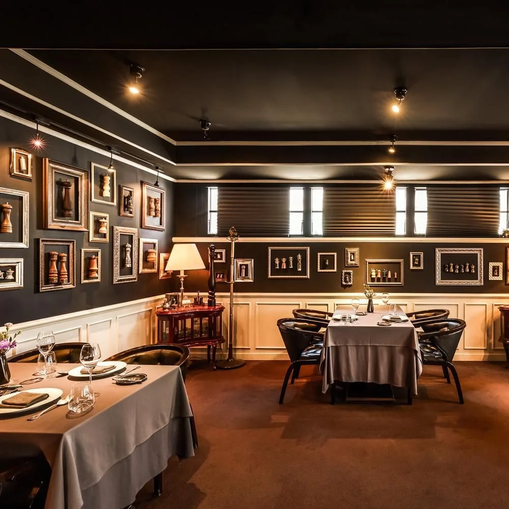 Moulin: bistro dining room with framed pictures