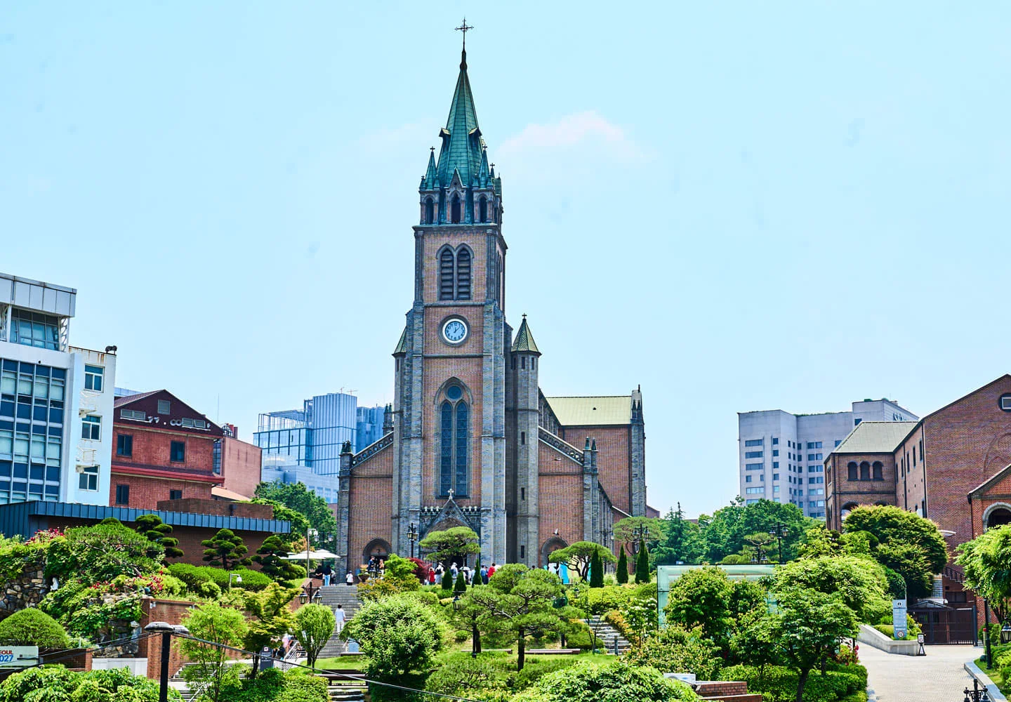The cathedral's tower rising above its planted grounds at Myeongdong Cathedral