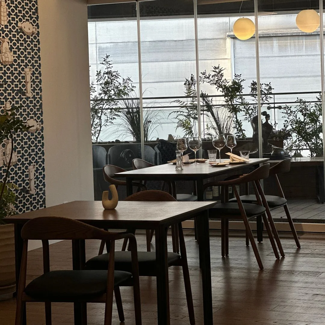 ON: dining tables beside windows and plants