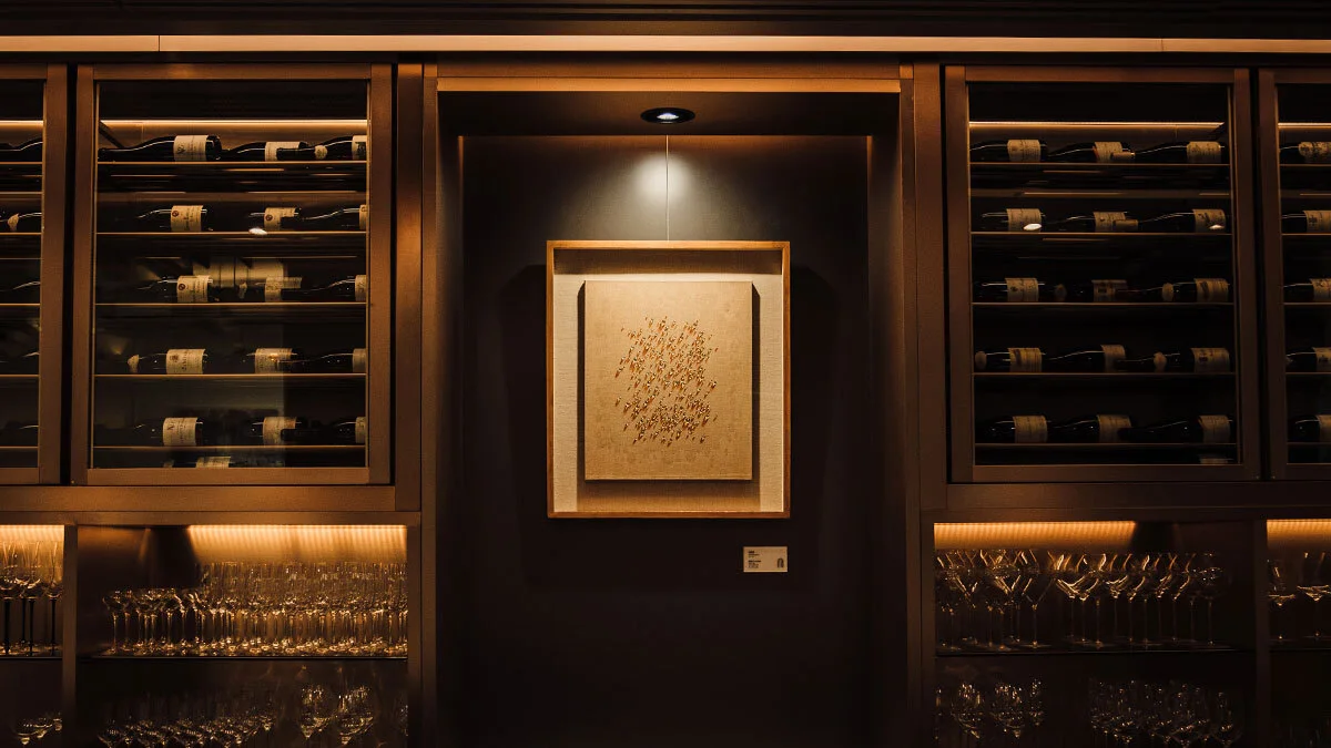 Illuminated shelves and a framed artwork at OPNNG