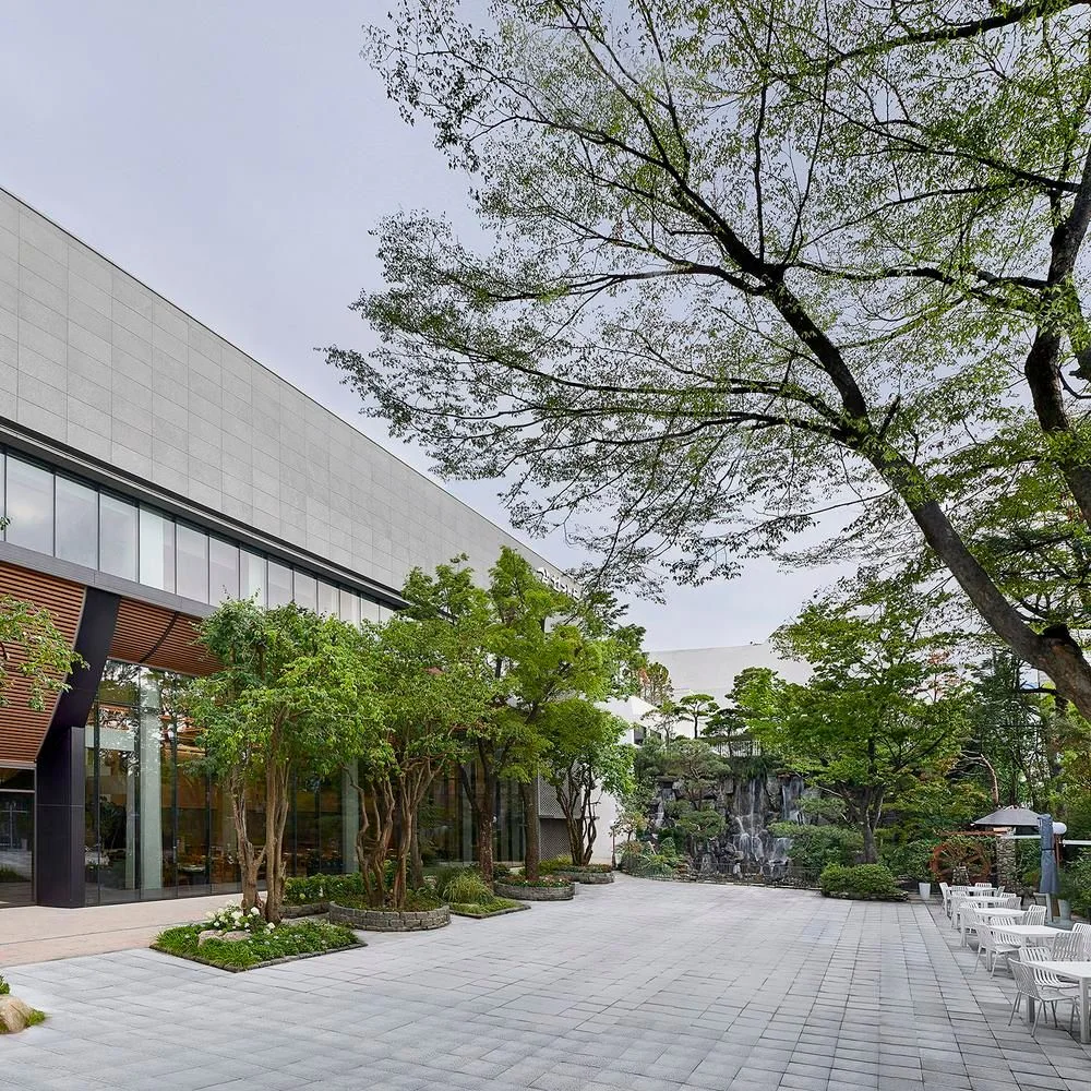 Samwon Garden: tree lined restaurant entrance