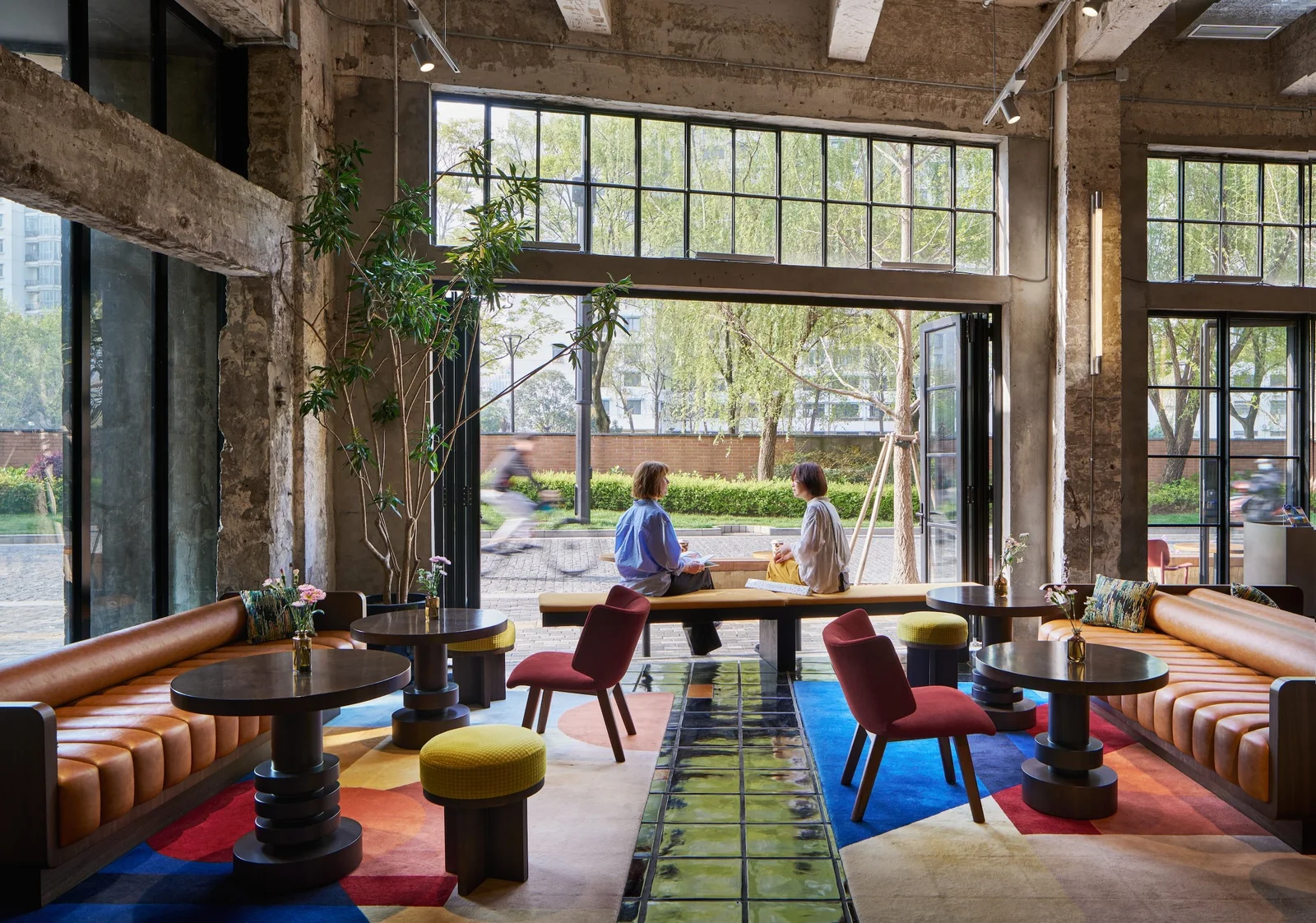 Fotografiska Shanghai: colourful lounge seating inside the restored industrial building