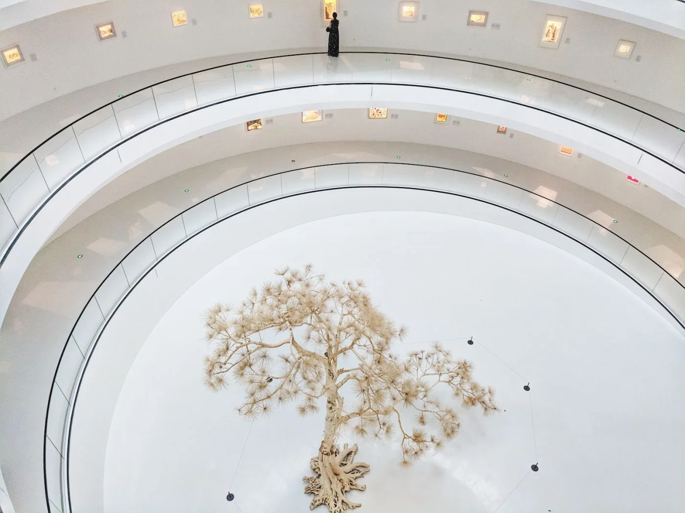 Powerlong Museum: the curved white atrium surrounding a suspended installation