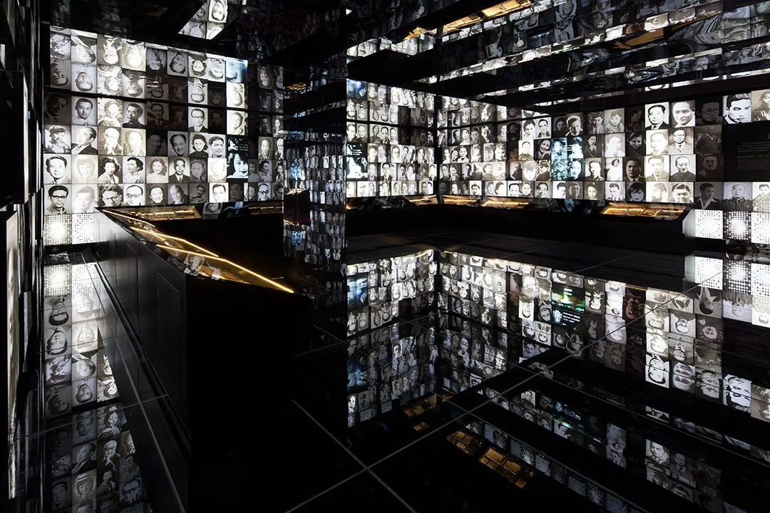 Shanghai Film Museum: illuminated cinematic portraits reflected through a dark exhibition space