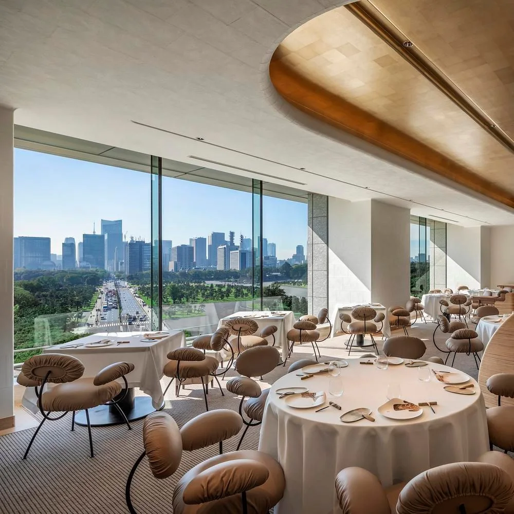 A light-filled dining room overlooking the city skyline at ESTERRE by Alain Ducasse