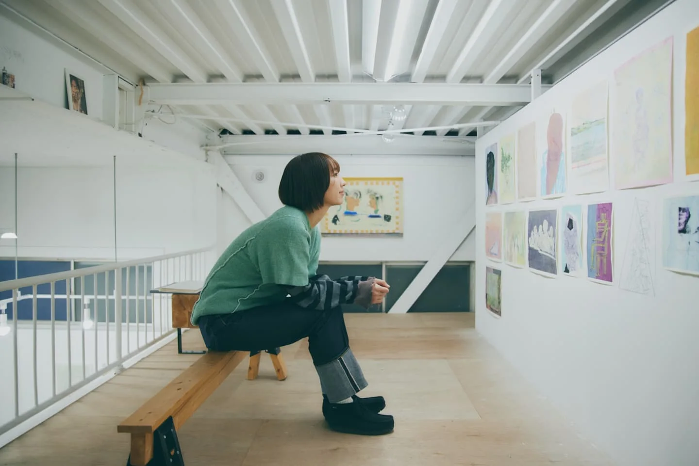 Kameido Art Center: a visitor viewing works in the bright gallery interior