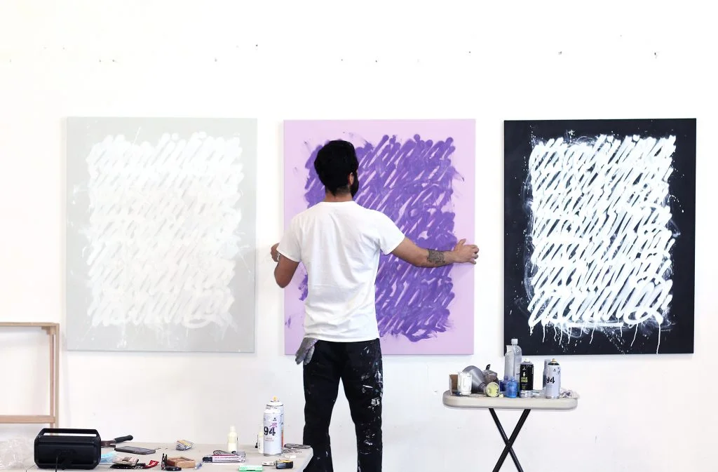 Otherwise Gallery: artist installing works in the gallery