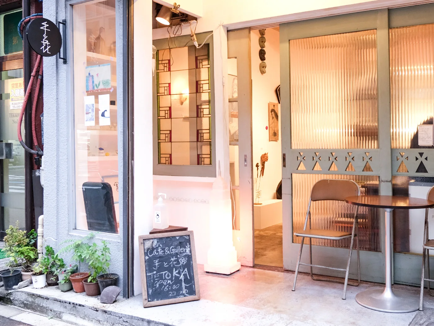 A warmly lit gallery and cafe entrance at Tetoka