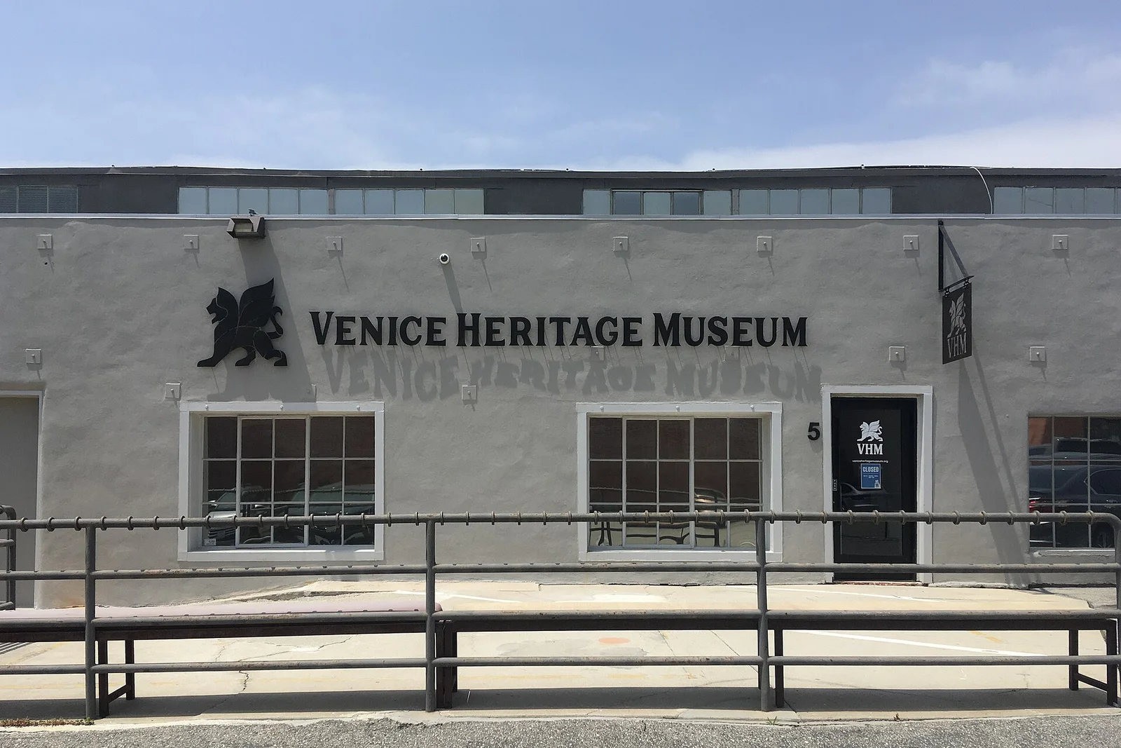 The grey facade and entrance of Venice Heritage Museum on Pacific Avenue, photographed in May 2024